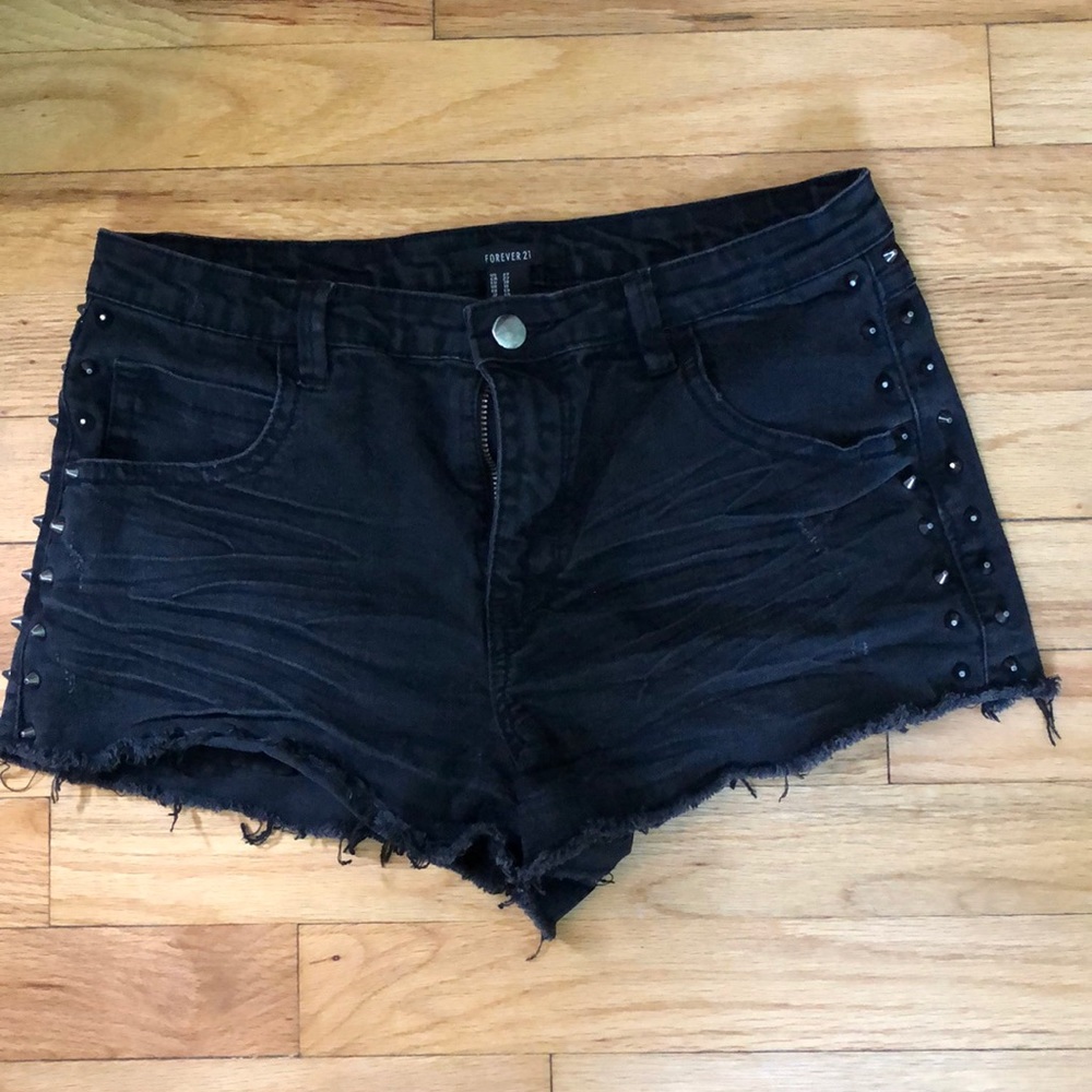 Distressed and studded denim shorts